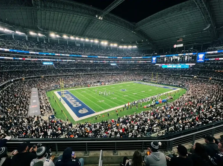 Packed NFL stadium with home fans creating atmosphere on game day